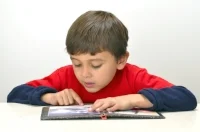 boy reading with finger onwords dreamstime_xxl_22430592.jpg