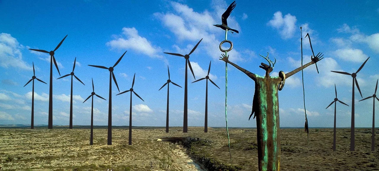 Windmills photoshopped into a sacred landscape.