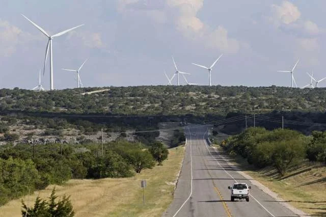 Another view of the undeveloped landscape and wind turbines.  Photo: Jerry Lara /San Antonio Express-News