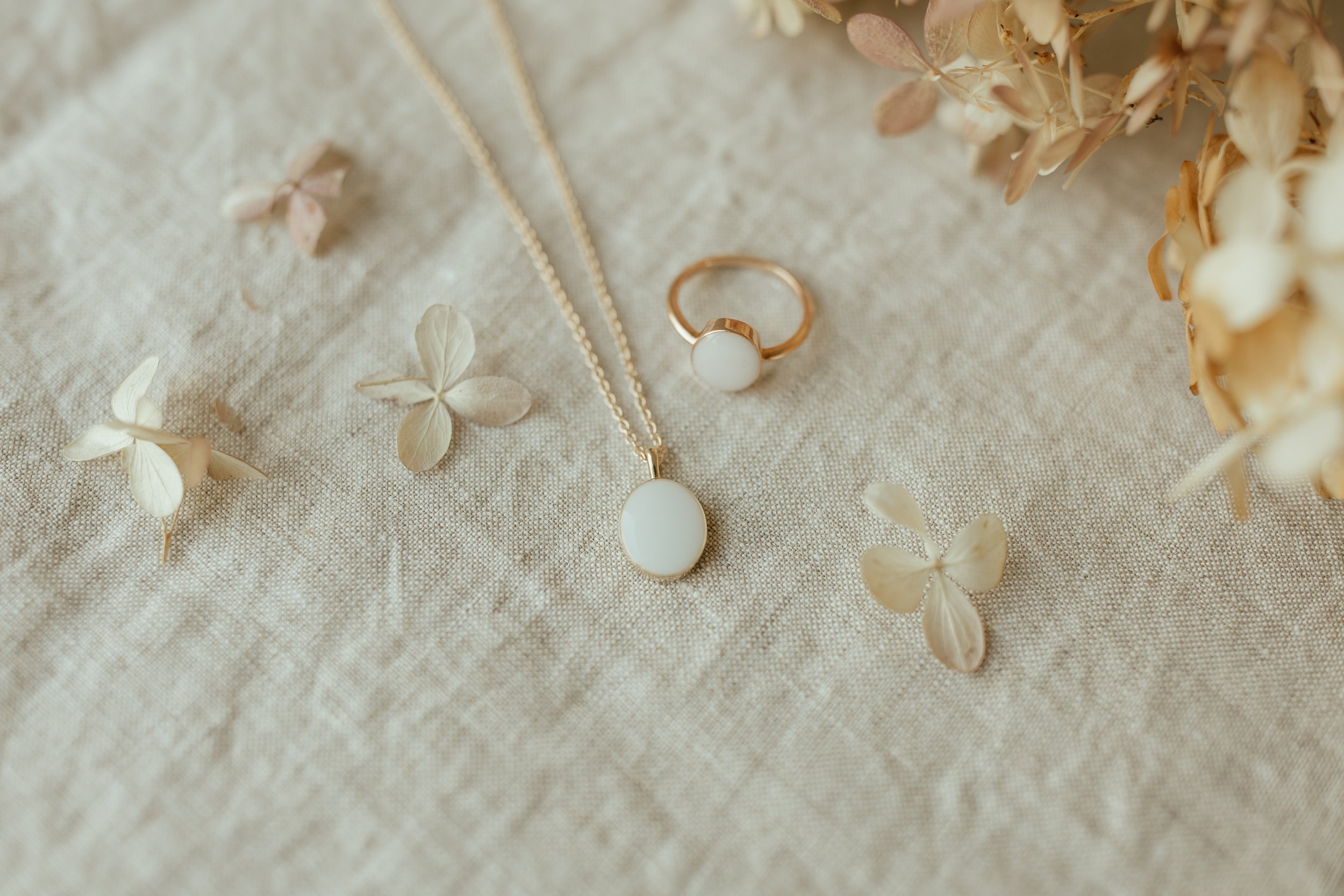 Solid Yellow Gold Heirloom Oval Necklace pictured with a Solid yellow gold heirloom oval ring made with breastmilk