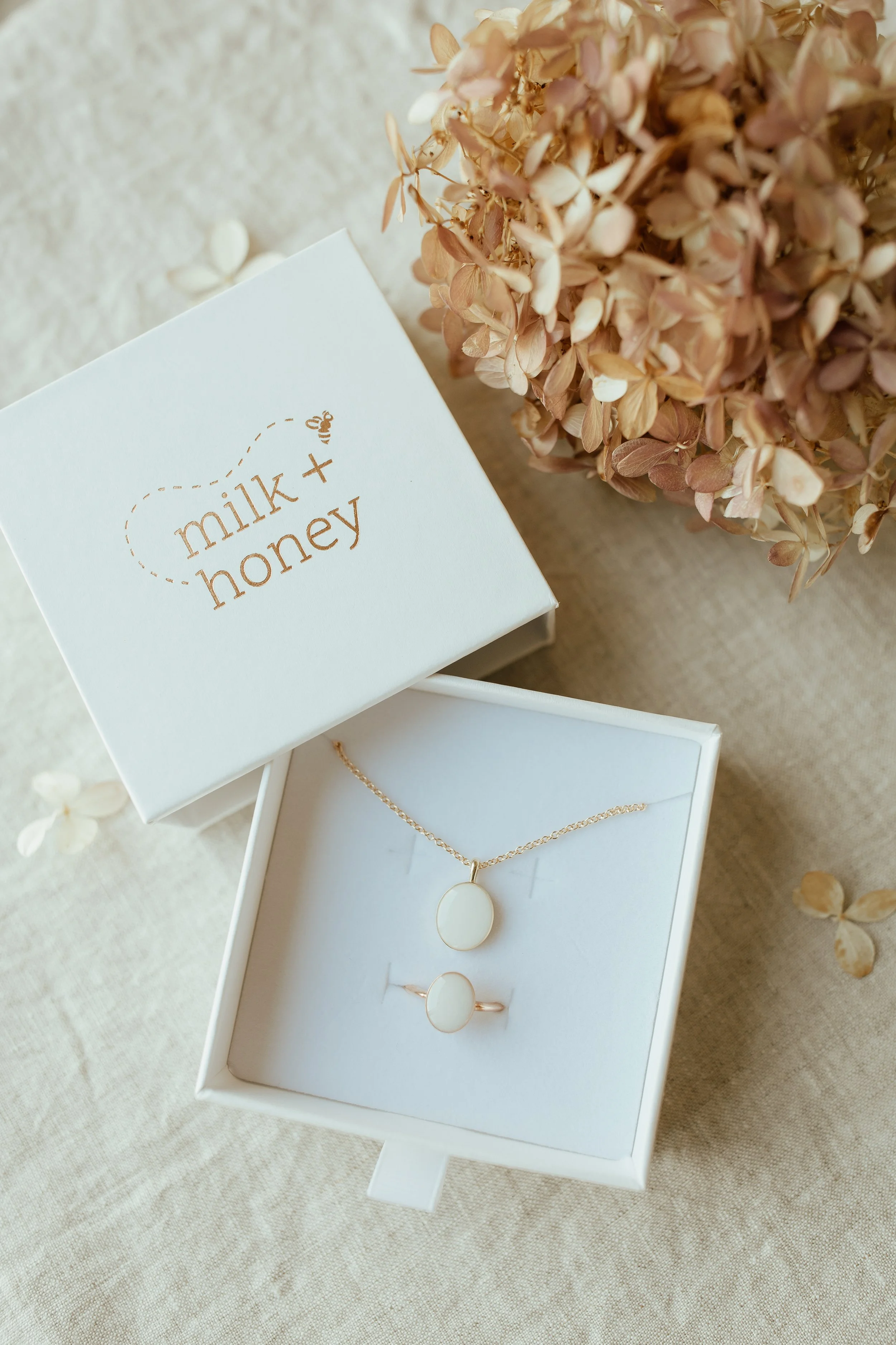 Solid Yellow Gold Heirloom Oval Necklace pictured with a Solid yellow gold heirloom oval ring made with breastmilk