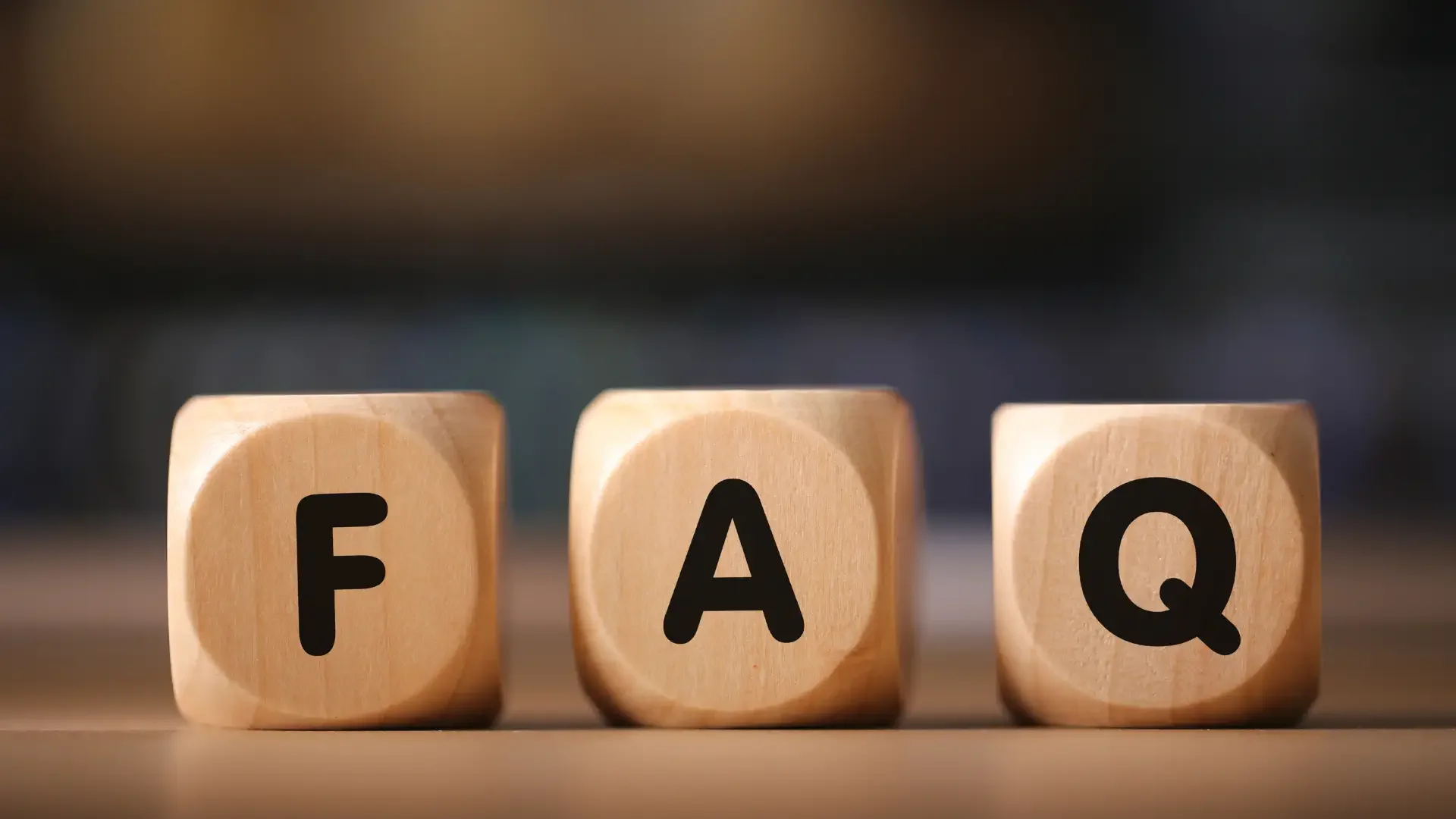 Wooden blocks spelling FAQ.webp