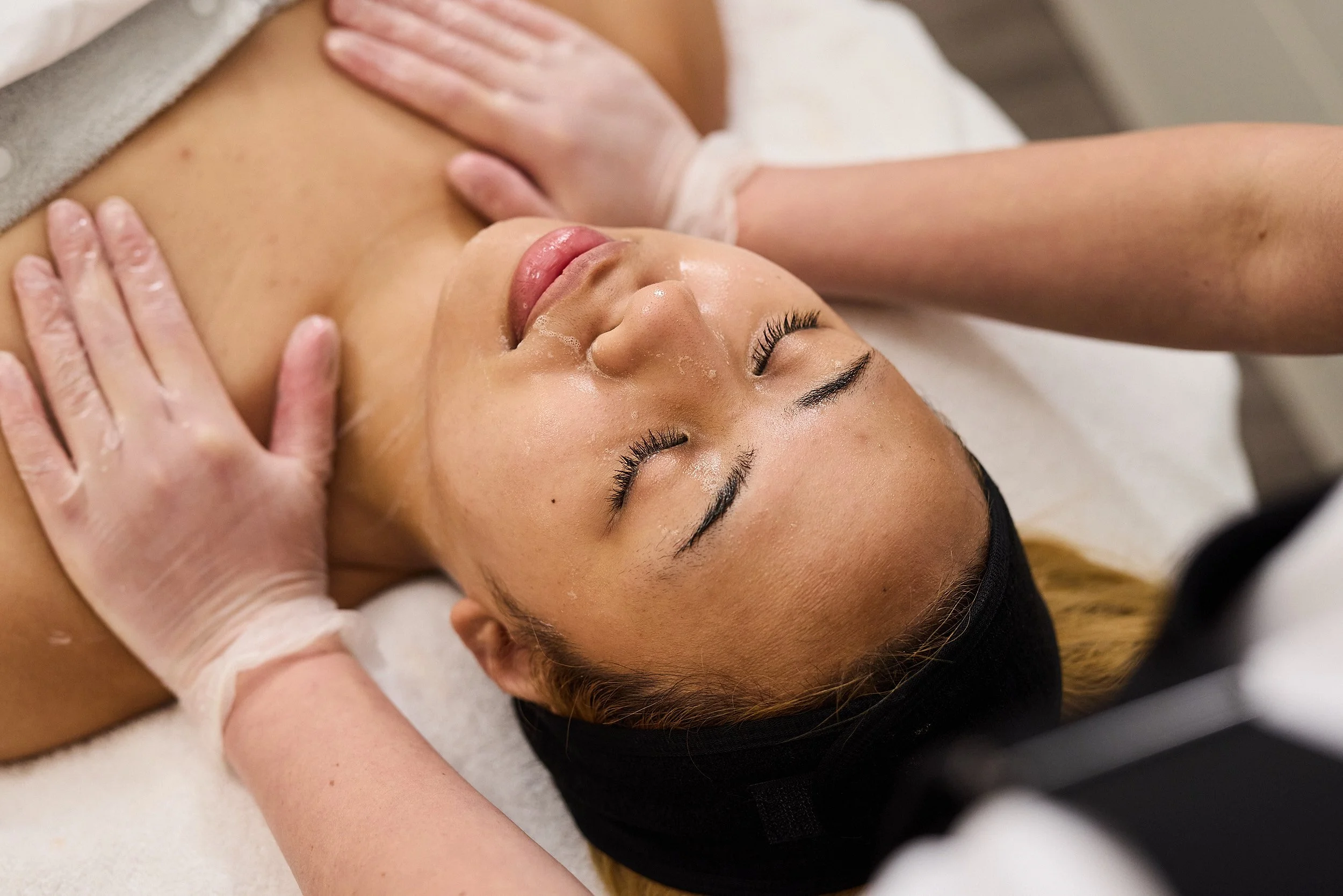 Skin clinician at St. Skin in North Melbourne giving client The Derriere Revive Treatment.