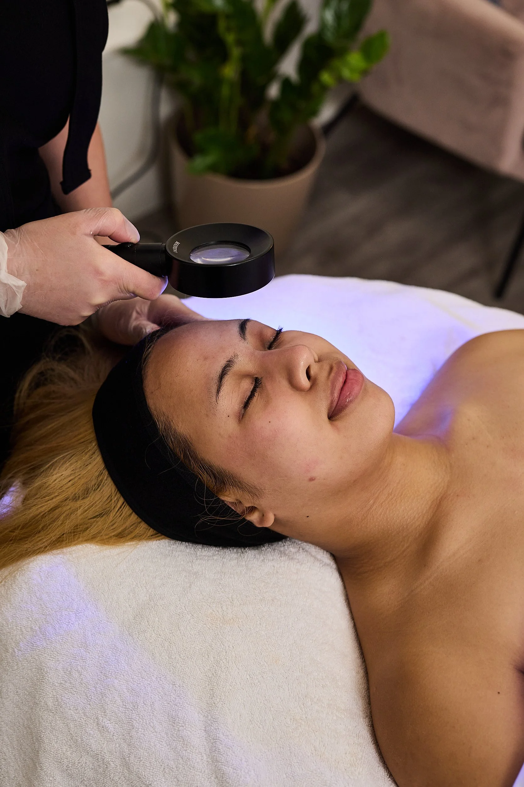 St. Skin Skin Clinician, performing safe extractions on client to target and safely clear blocked pores, blackheads, milia, and congestion from the skin.