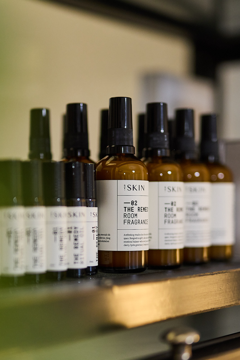 St Skin’s Remedy 02 Room Fragrance bottles on clinic shelf with Ritual Oil.