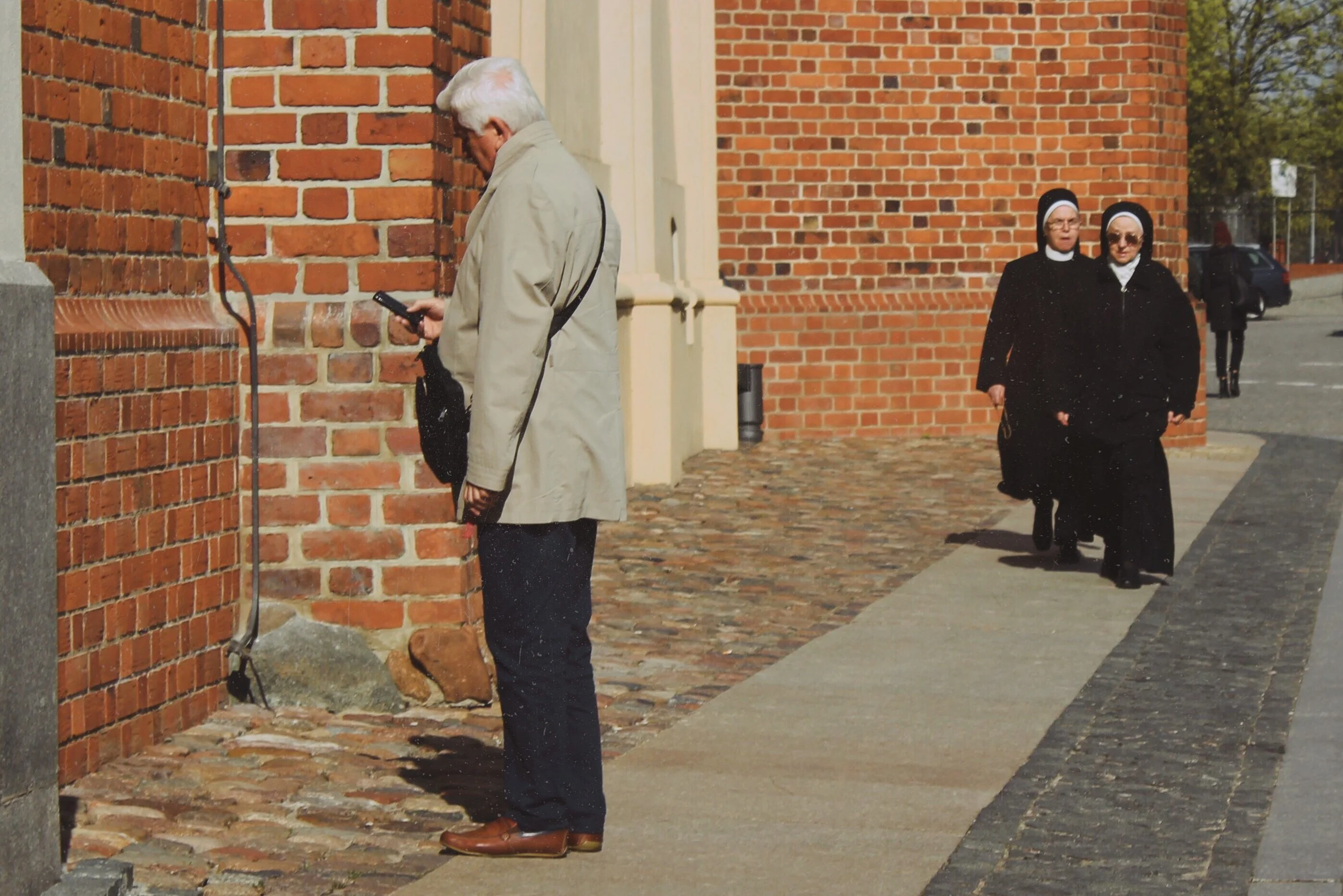 Poland Poznan Church Two Nuns Walking One nun.jpg