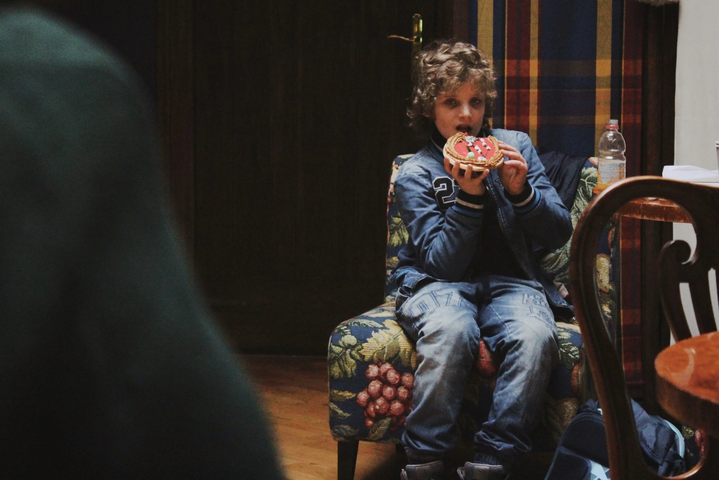 Poland Poznan Little Boy Eating Christmas Cookie.jpg