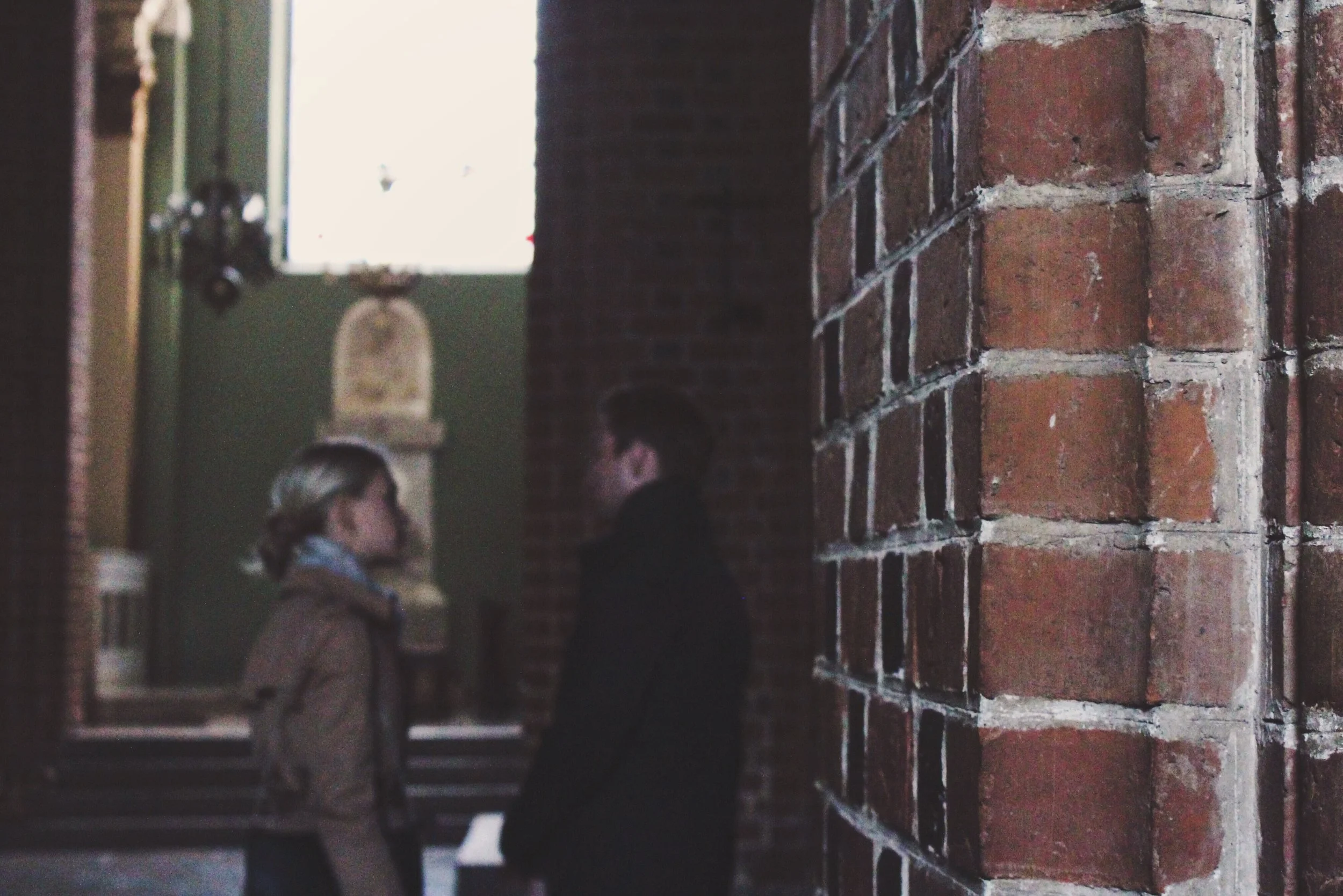 Poland Poznan Man Woman Talking Church Brick Wall.jpg