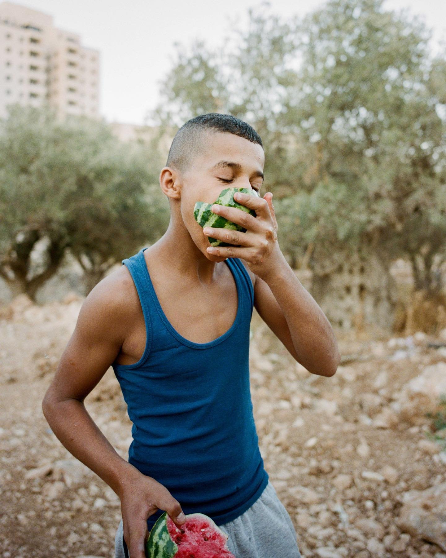 &ldquo;I was walking around Bethlehem with my camera, as I tend to do, and met this group of boys who were playing in the land. They were very playful and just by talking to them, we kind of became friends. One boy went to pick up his watermelon from