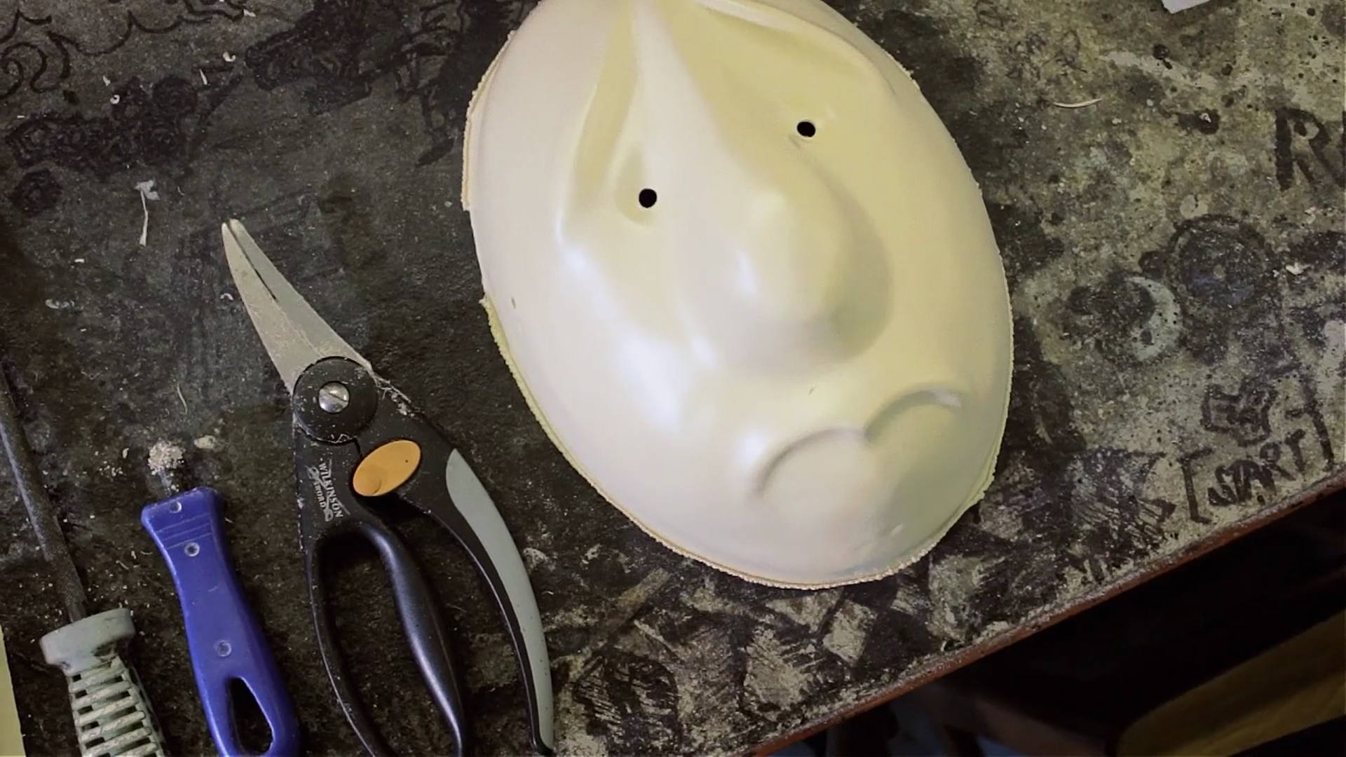 7) The Masks are hand cut to shape and all holes and rough edges are filed smooth.