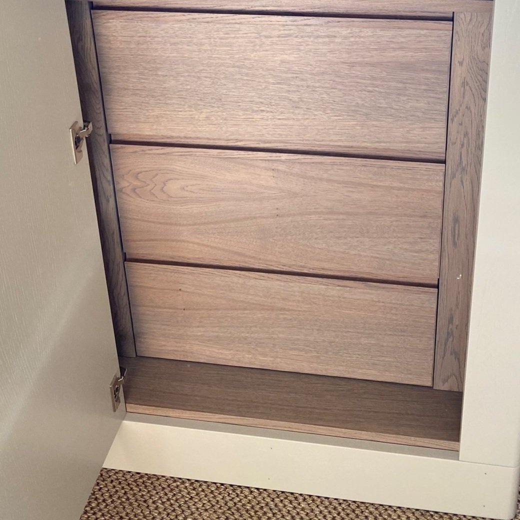 drawers inside a custom made wardrobe made in stained oak wood. 