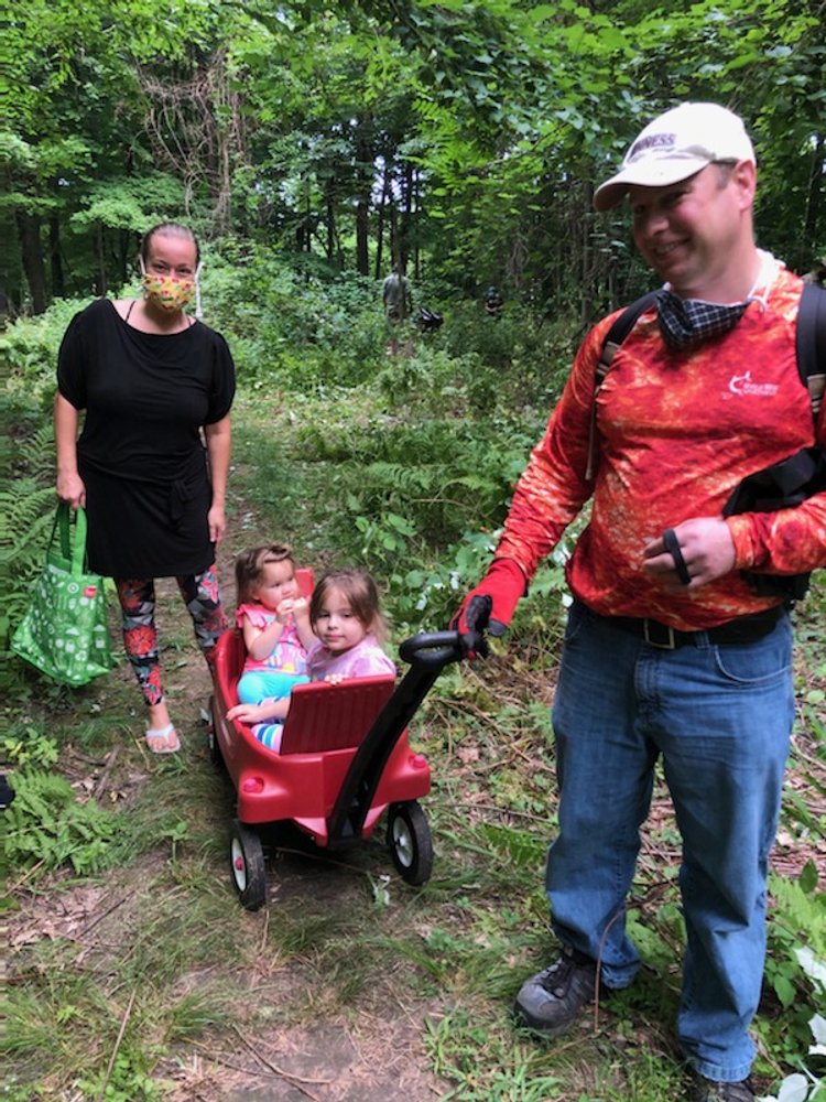 Family looking for wine berry.JPG