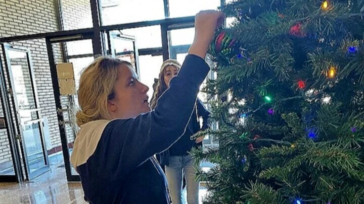 Season's Greetings!  Peer Leaders and Friends Decorate the Tree