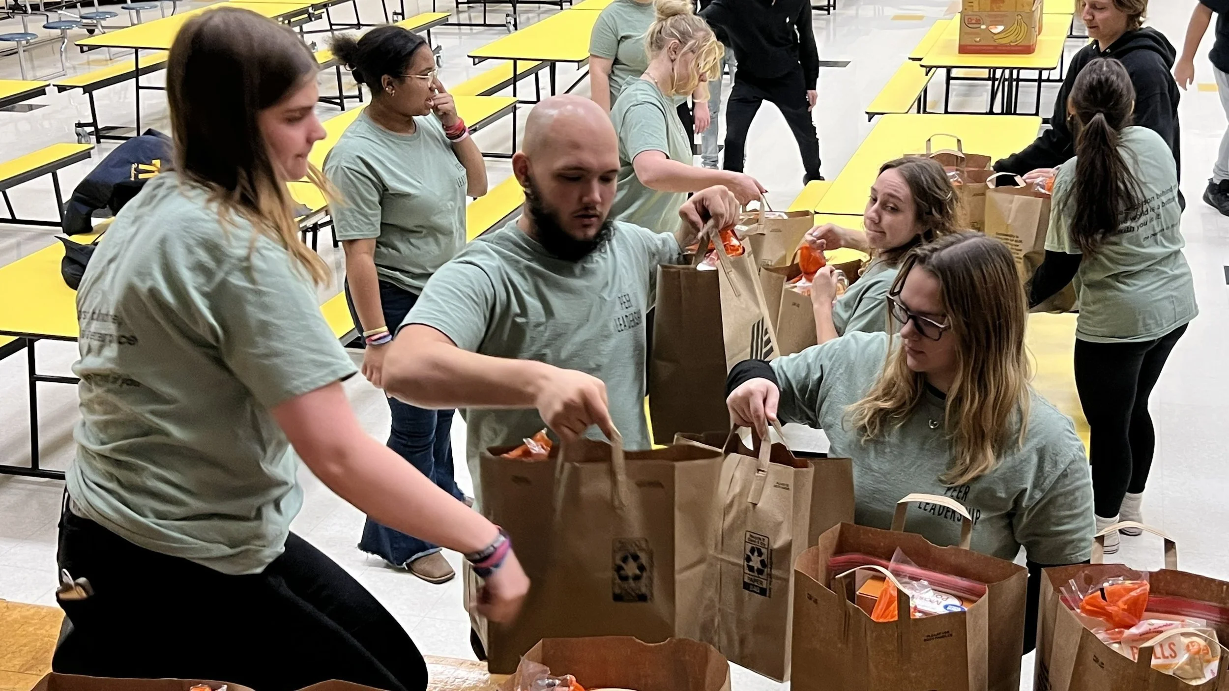 "Turkeys CAN Fly!":  Peer Leaders Pack 80 Dinners