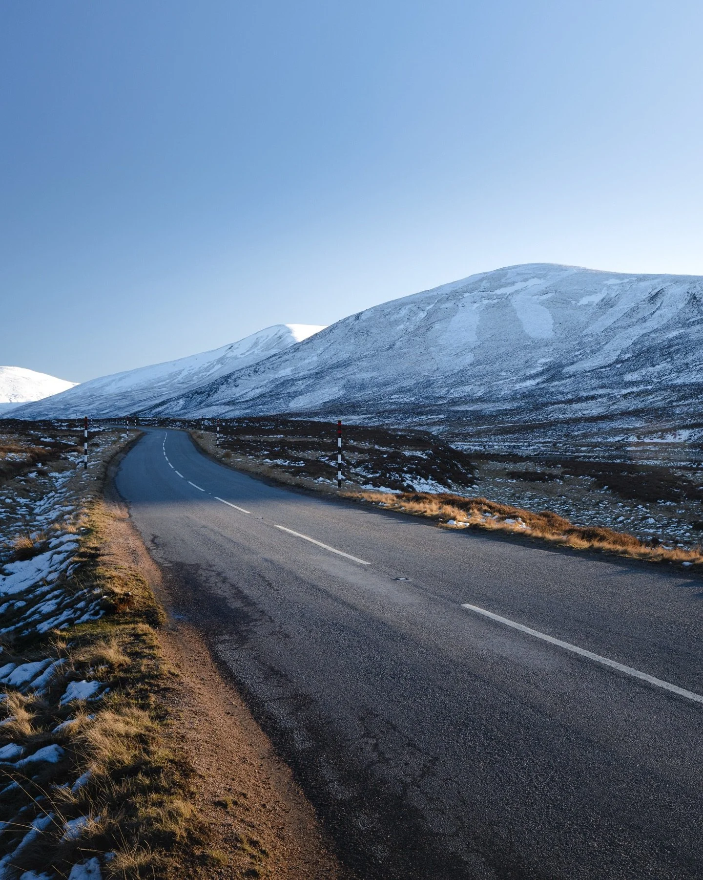 Vibrant warm hues from the lowering sunlight contrasting against the cool blue of the snow and long shadows of the mountains. The snow glowing at the head of the glen. Feel so lucky to live in a place like this.

Swipe for a pano of the full shot acr