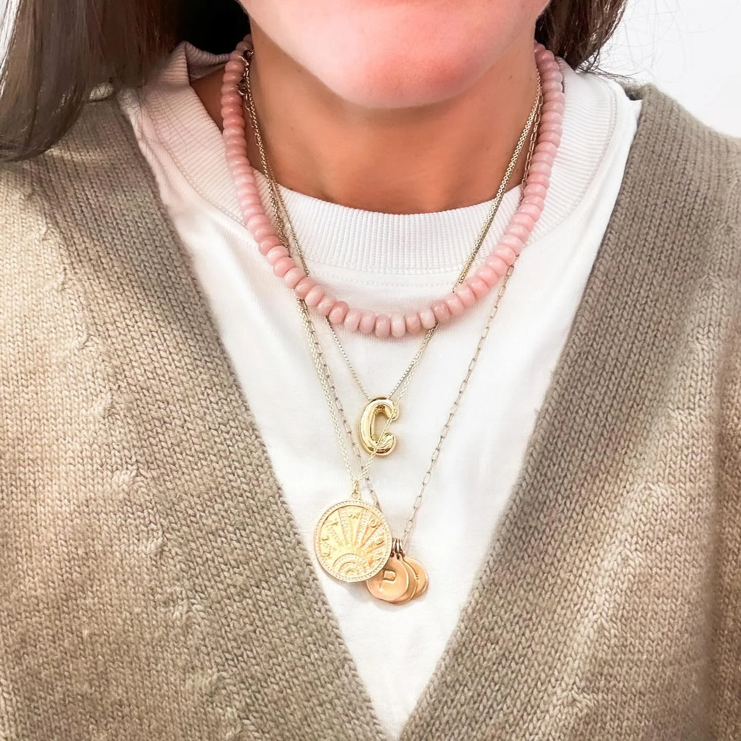 Today&rsquo;s necklace stack! We are basically updating our website daily with new pieces! Today, we added this gorgeous dusty rose gemstone necklace, and a lucky charm medallion! Swipe for close up details and comment NECKLACE for a link to shop 😘