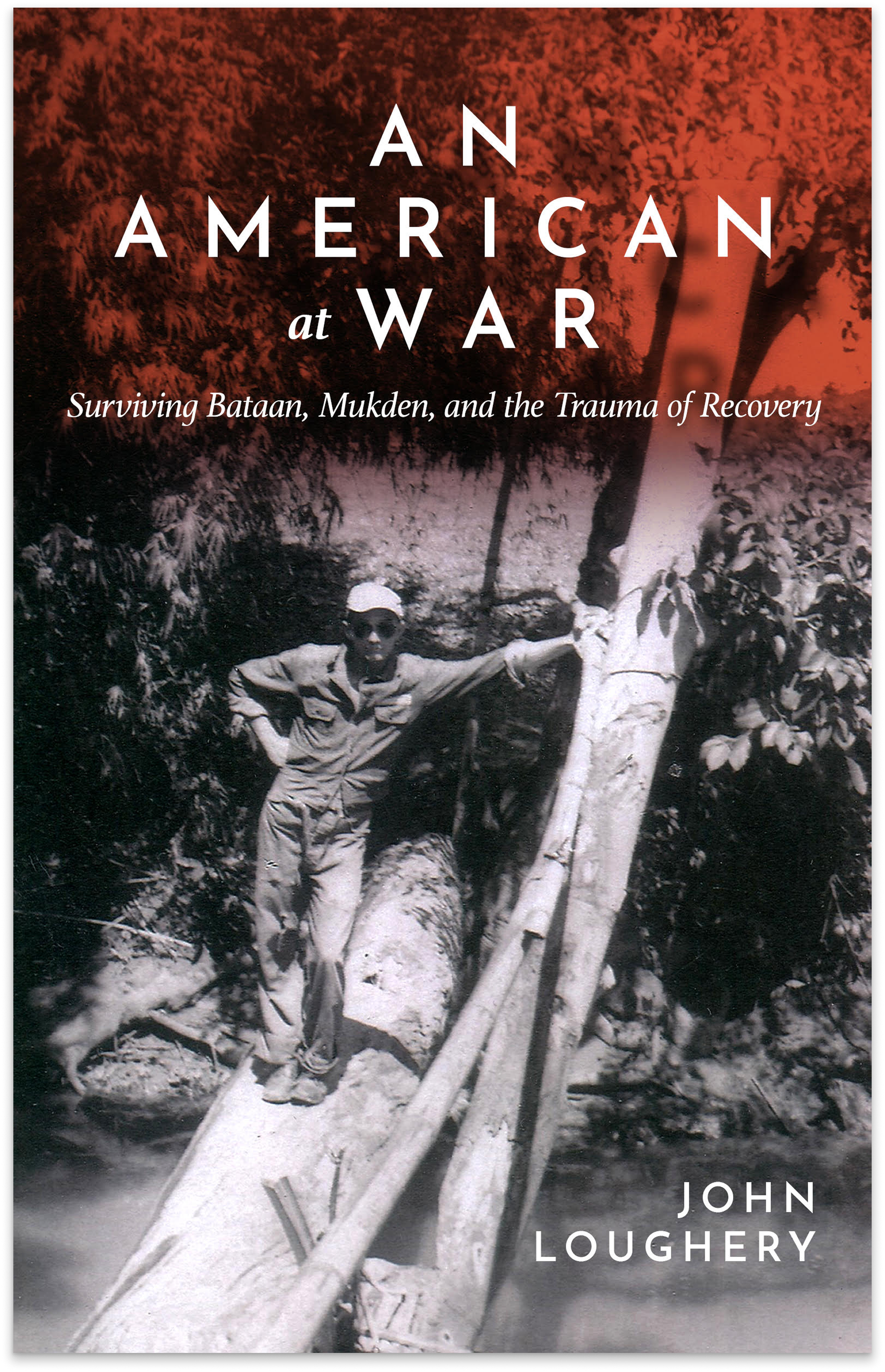 Cover of An American at War by John Loughery, with a vintage photo of a soldier standing on a felled tree