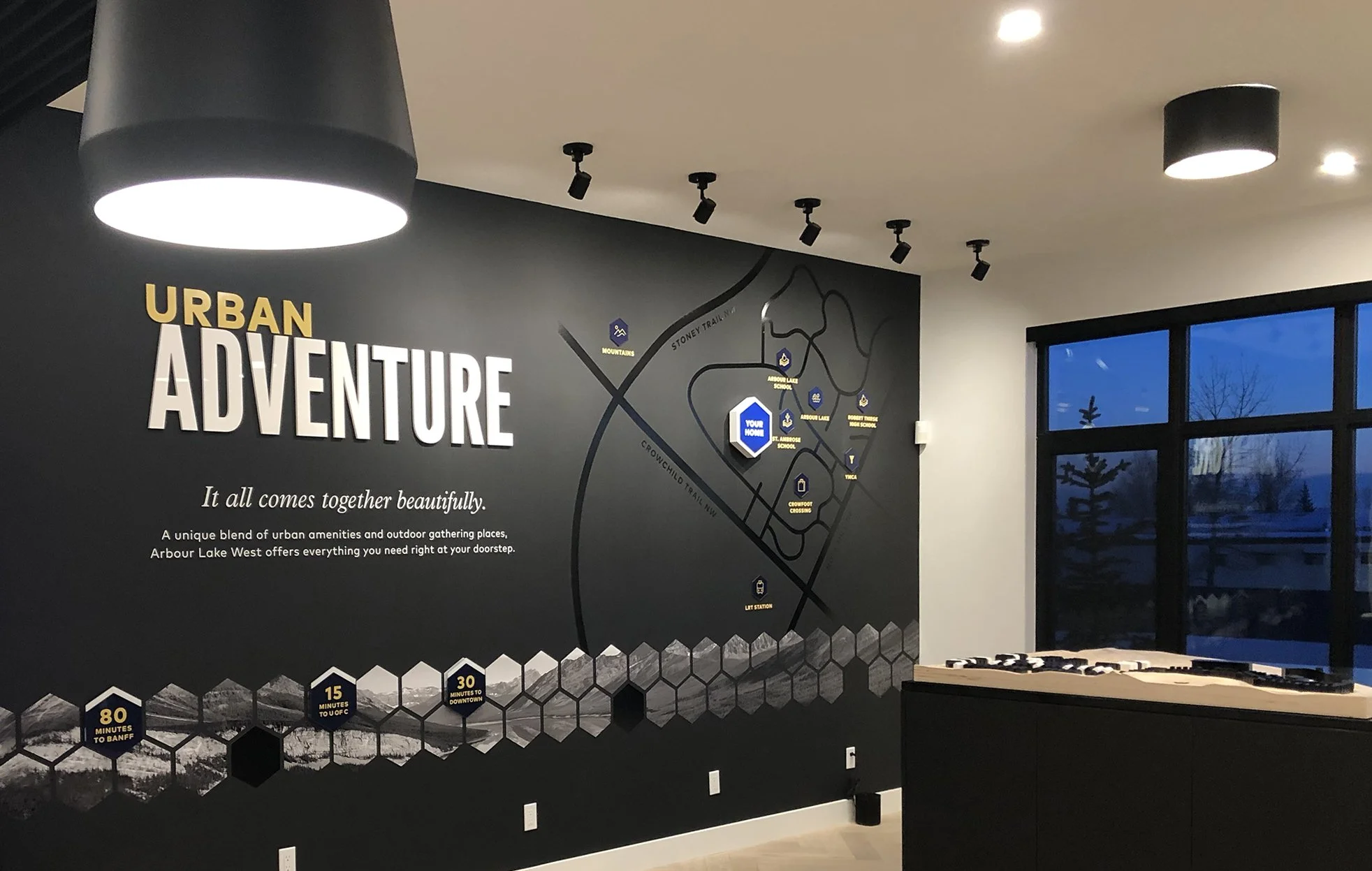 Community map feature wall with dimensional type and applied vinyl graphics