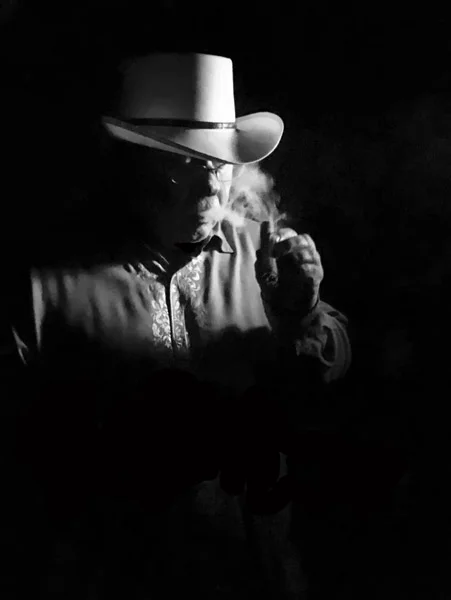 In the shadows, hiding from the world.