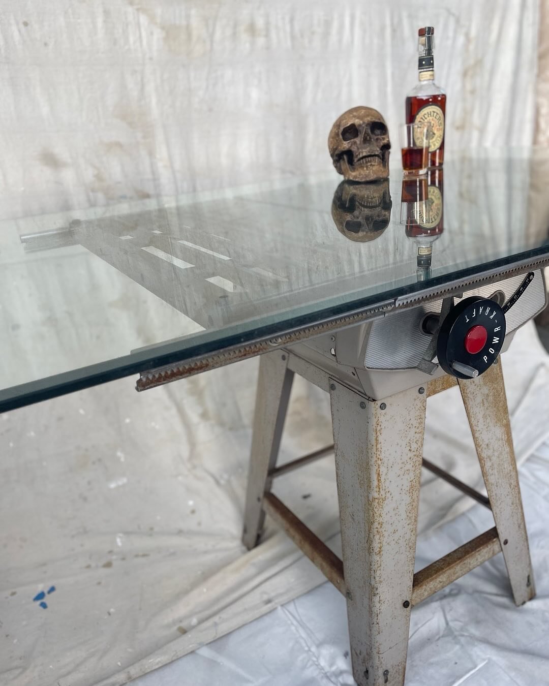 Part 2 of the orphaned table saw. 

Behold - Table Saw Table 

Never SAW such a table? 
That glass top is CLEARLY perfect for resting your drink in between sips, or maybe it&rsquo;s that unique display table you&rsquo;ve been dreaming about all your 