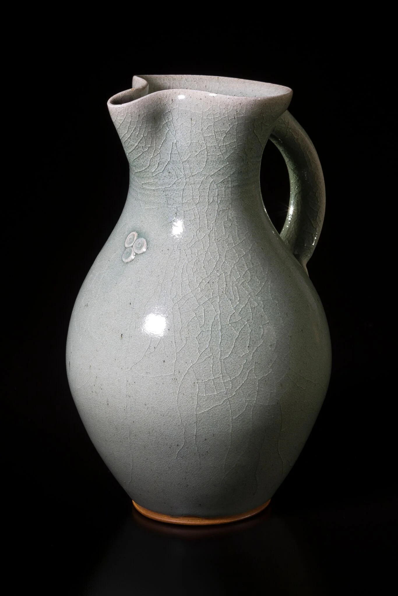 Celadon pitcher - Jay firing.jpeg