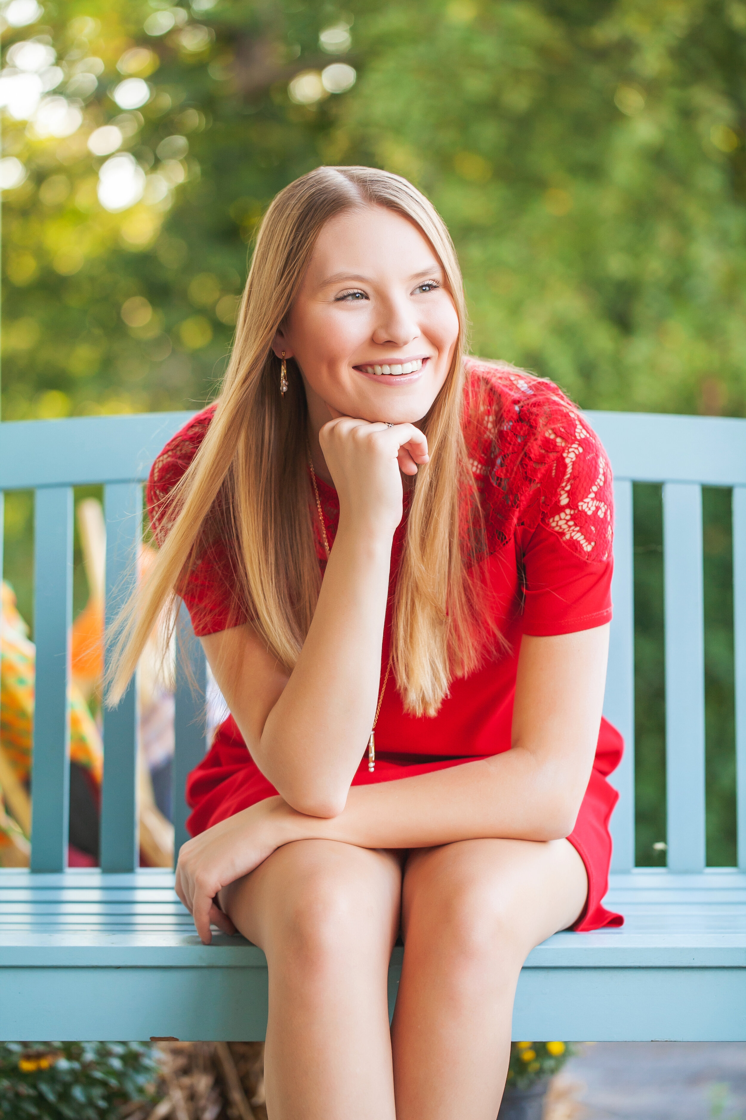 senior-pictures-unique-locations-porch-swing-red-dress-turquoise-swing-fun-backgrounds-senior-photography