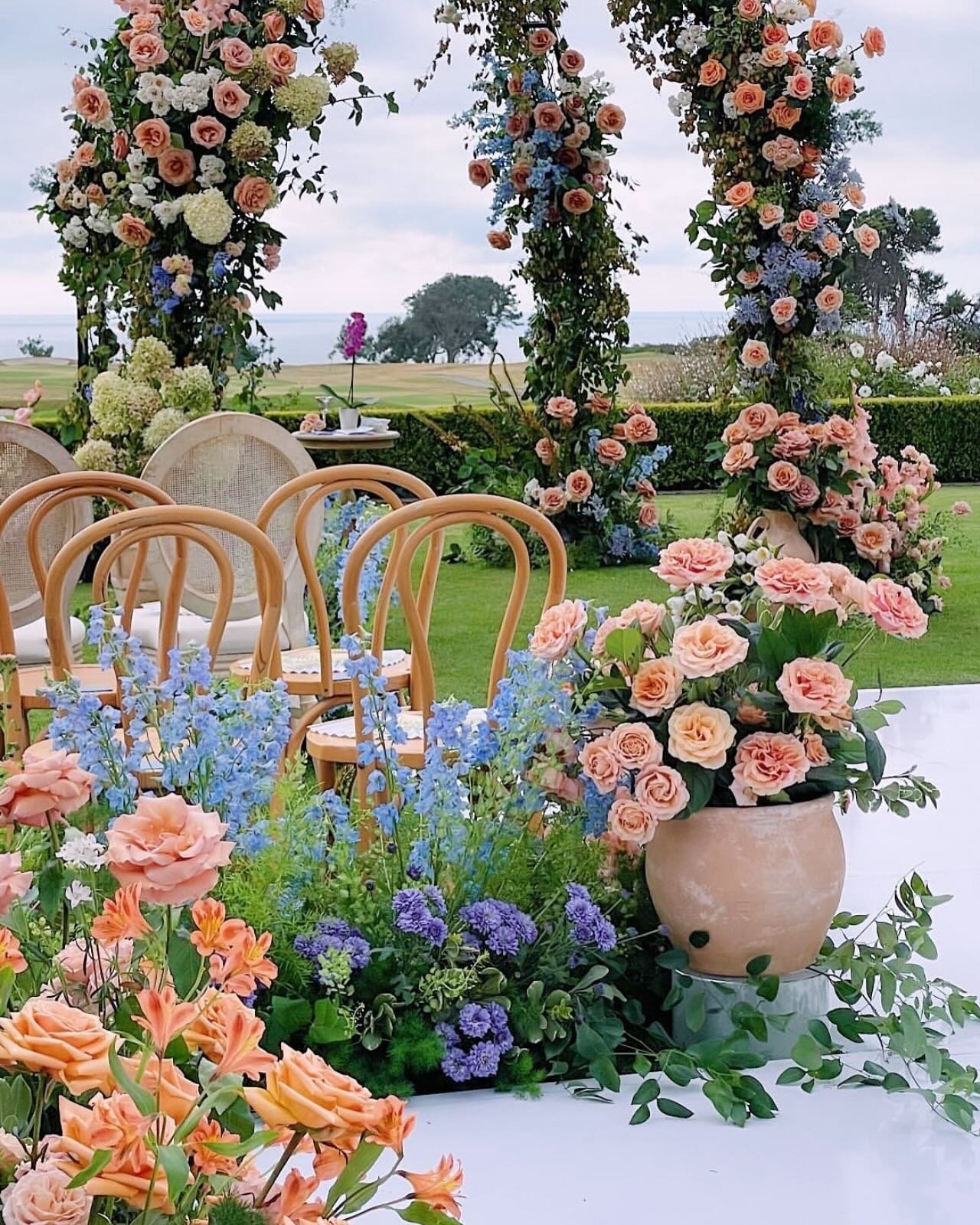 POV my two favorite decor images from @jennyquicksall  showing the ceremony set up then we added chandeliers and put the head take underneath the arbor for dinner . Incredible floral @tularosaflowers and location @lodgetorreypines  @enticingeventrent