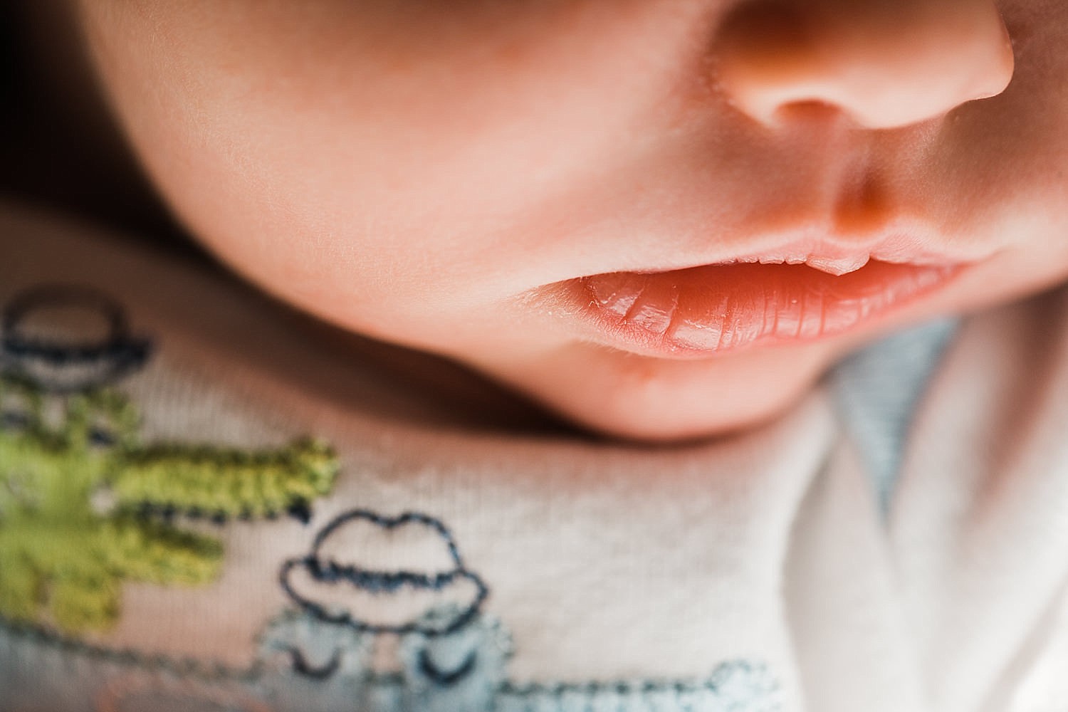  Close up image of newborn baby lips. 