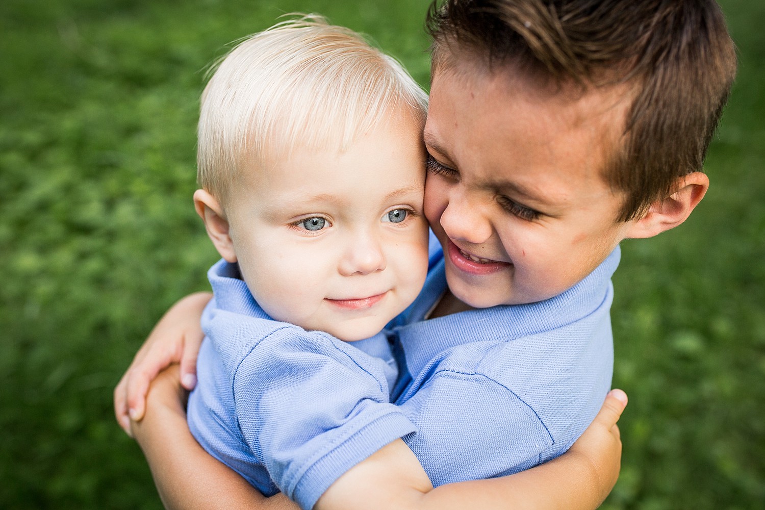  Photo of two little boys hugging each other. 