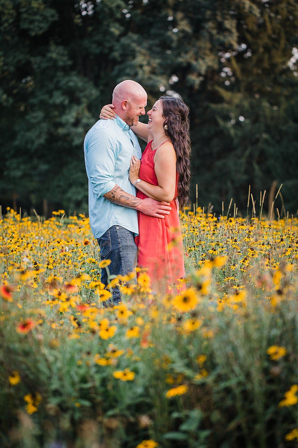 Colorful summer couple in a wildflower field