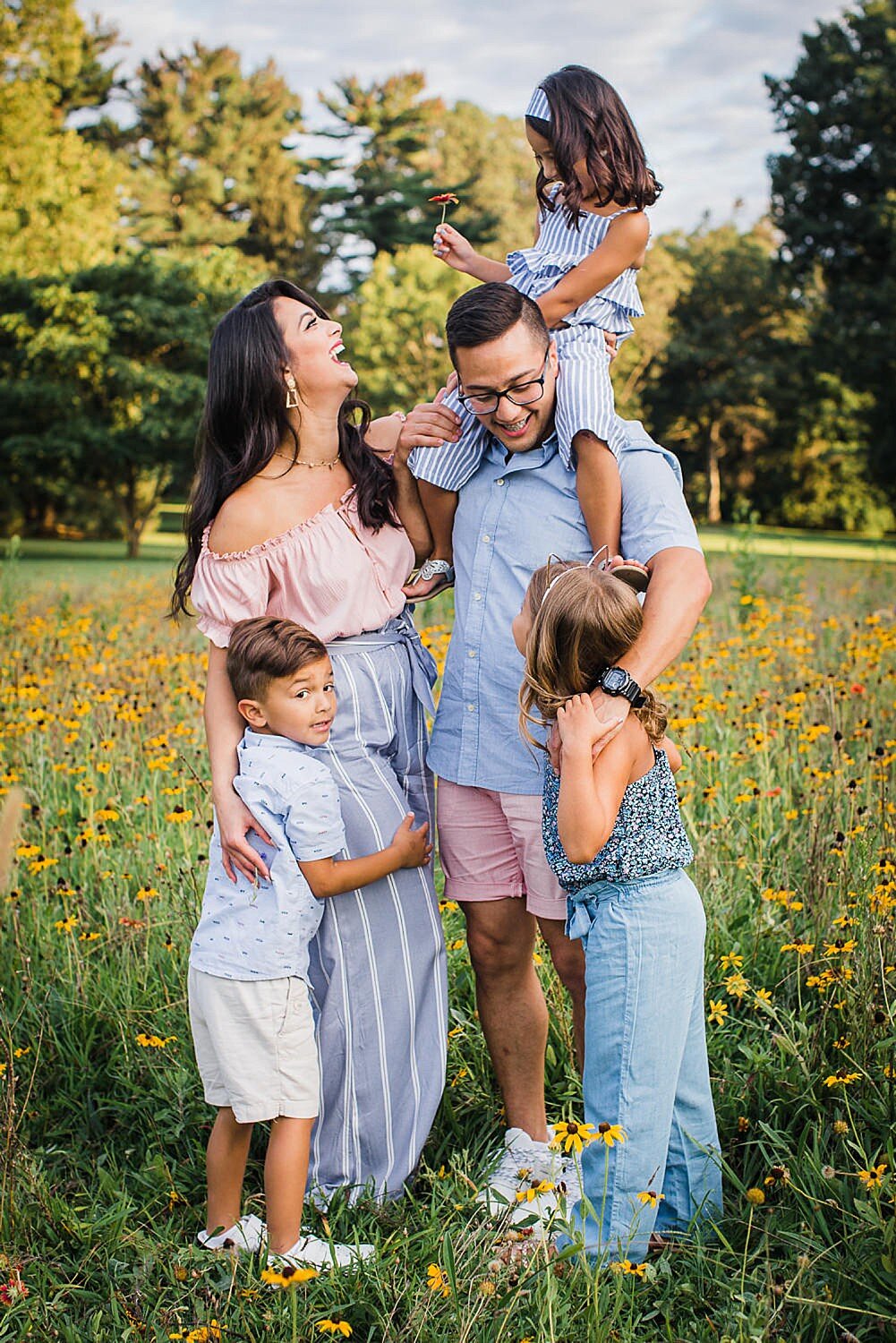 Colorful summer family in a wildflower field