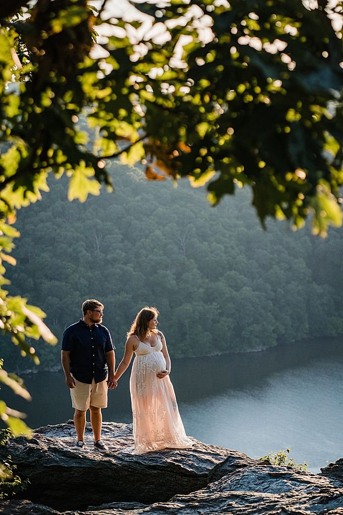 Couple stands on an overlook