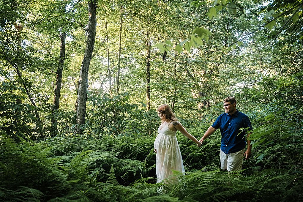 couple in a forest of ferns