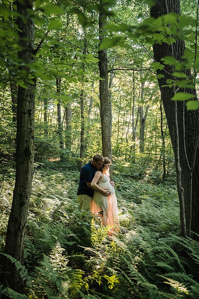 couple in a forest of ferns