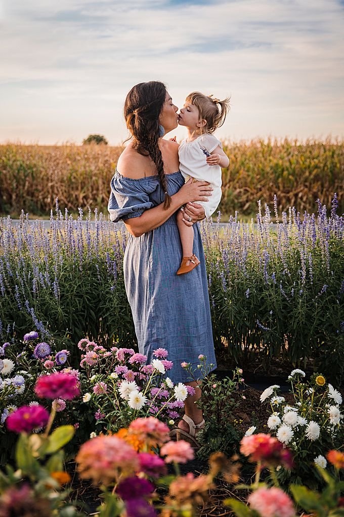 mother and daughter in a field of flowers