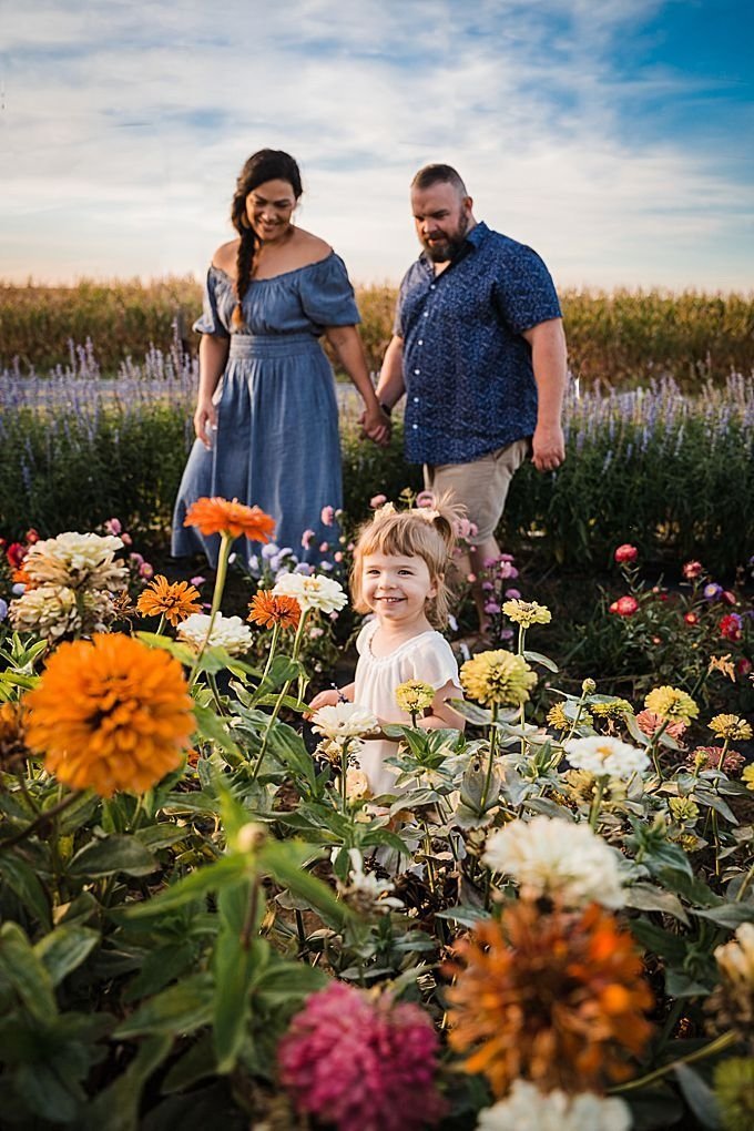 Family in a flower field of zinnias