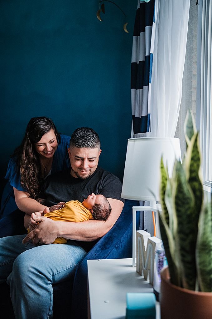 Couple holding their newborn baby boy