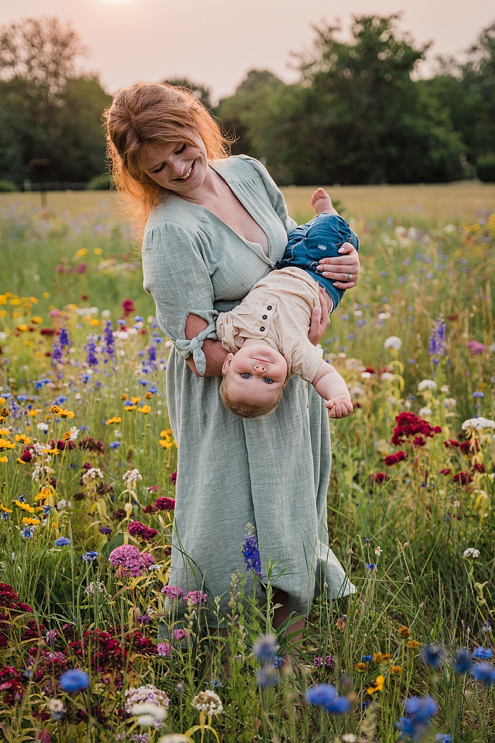 mother and son in wildflower field