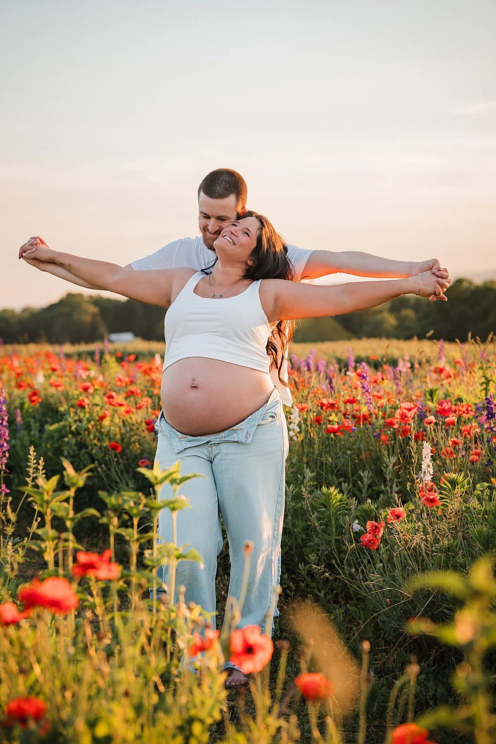 Bare belly maternity photos in the wildflowers