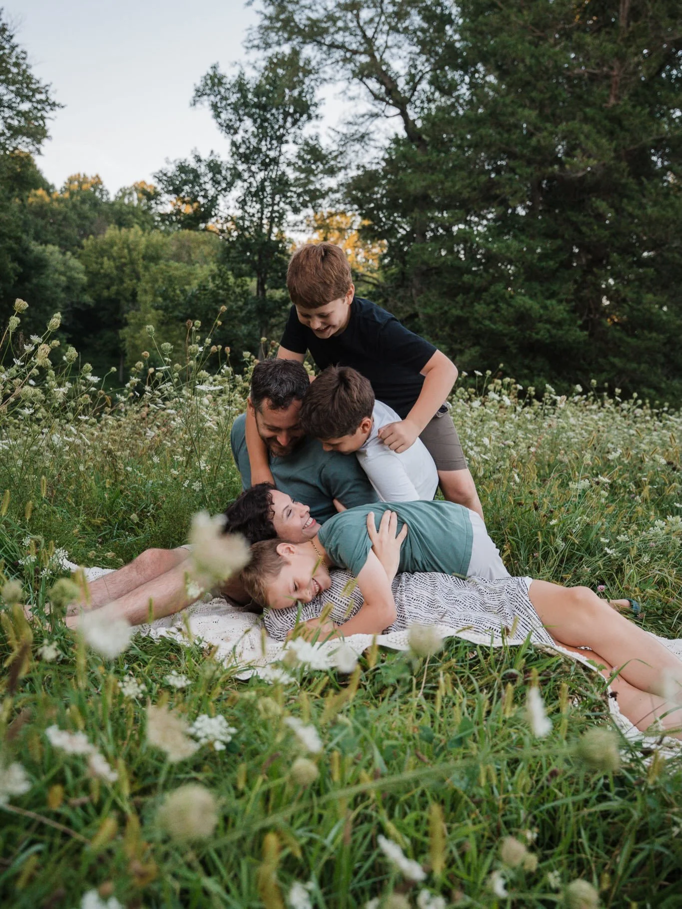 New favorite prompt: the family pile-on 😄 Kids sneak up behind mom and dad enjoying their quiet moment on a blanket and pile on top.

The Stoltzfoos family enjoys creek stomping so we made that the focus of our photo session at one of their favorite