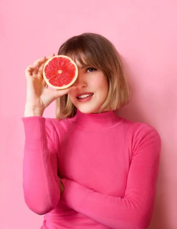 model with grapefruit.jpg