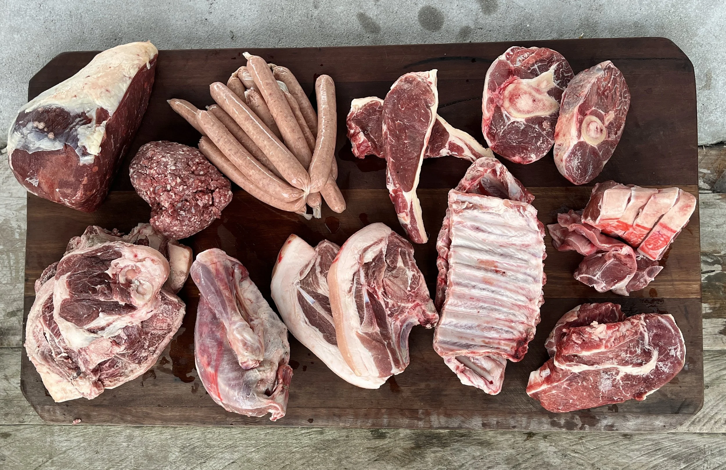 An array of meat cuts laid out on a table