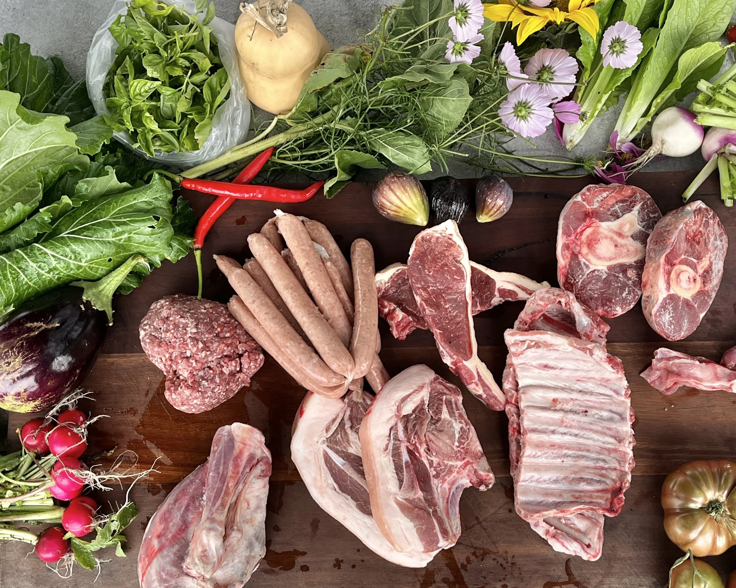 A mix of vegetables, meat and flowers
