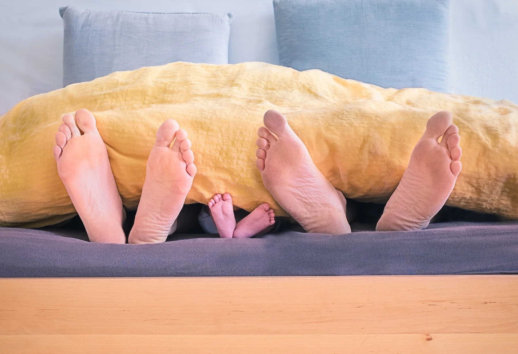 family feet in bed copy.jpeg