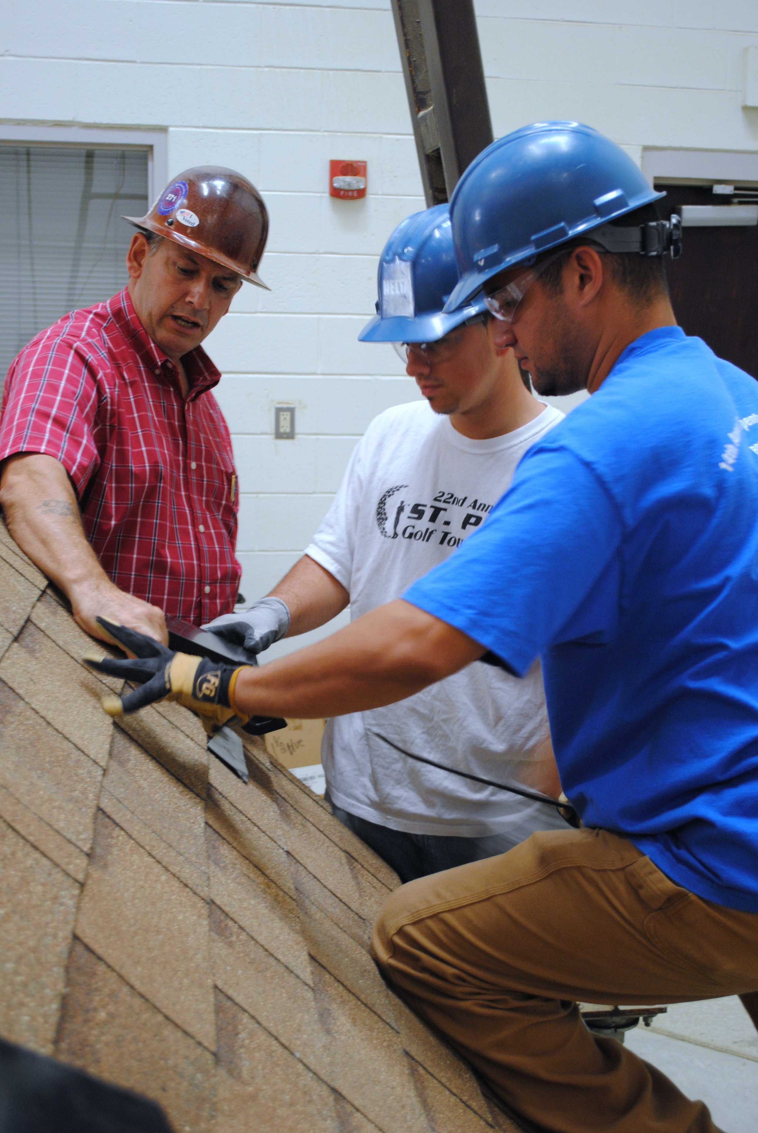 Instructor teaches proper roofing techniques.JPG