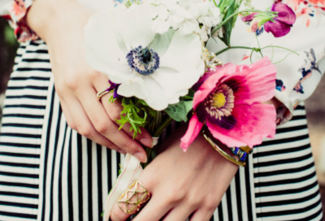 woman holding flowers.png