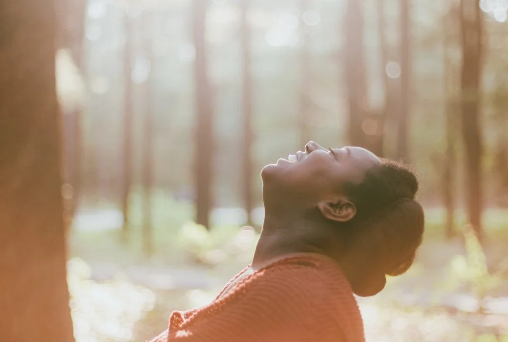 woman eyes closed looking up and smiling.jpg