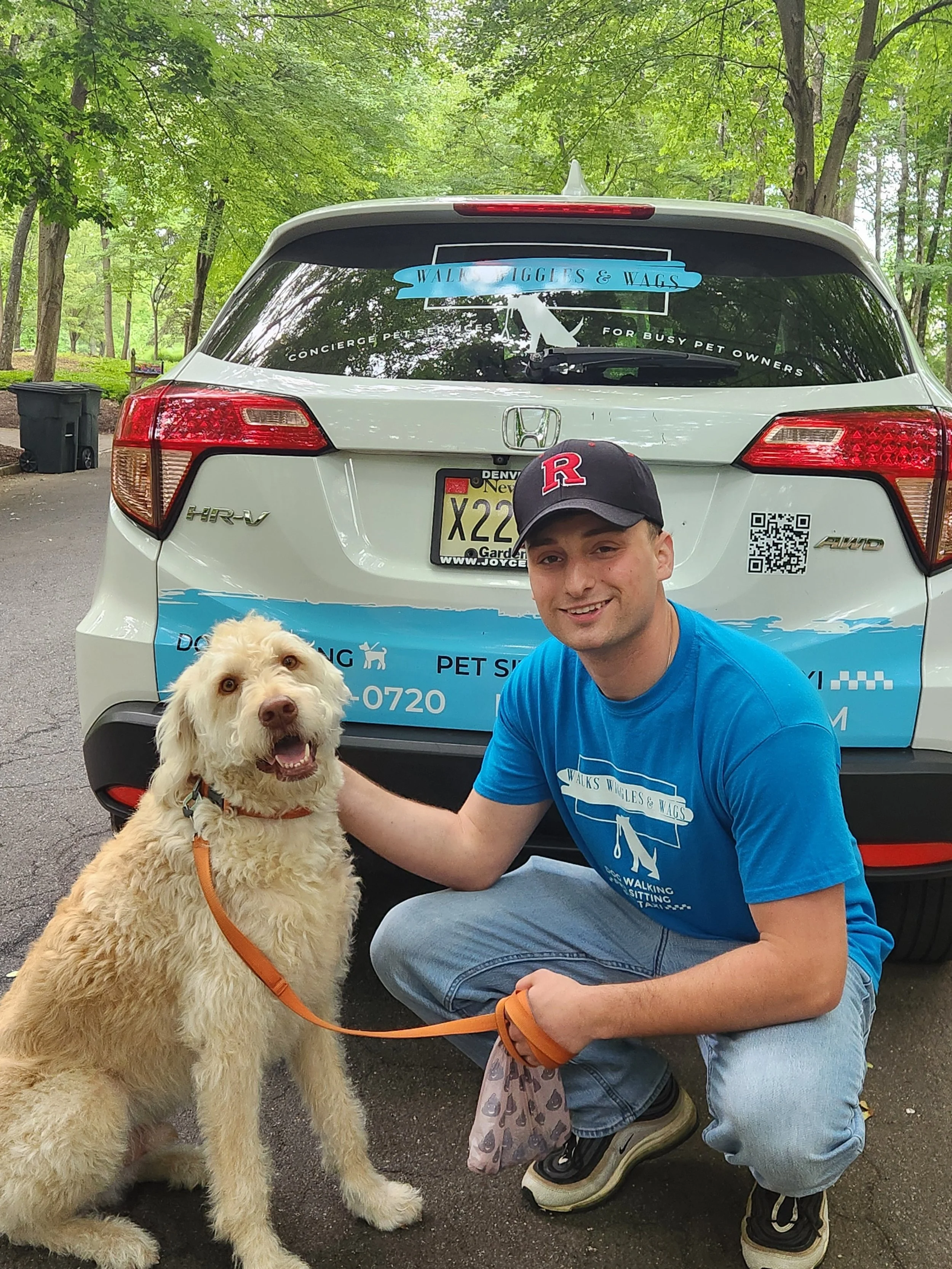 Walks Wiggles and Wags dog walker with a doodle before a midday walk — Chester, NJ