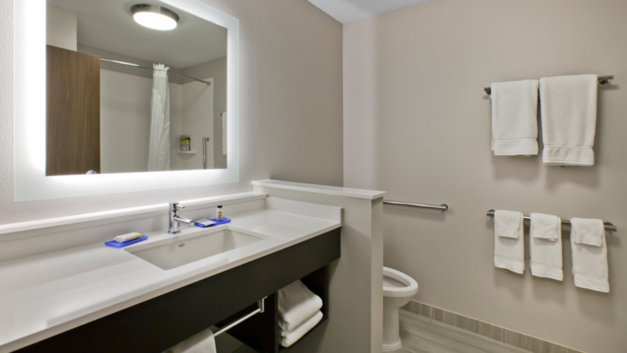 Bathrooms at Holiday Inn Express &amp; Suites in Green River, UT - Hotel Architect