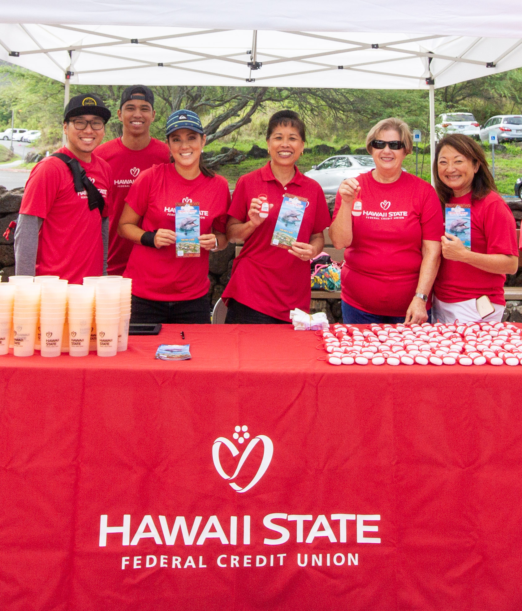 Hawaii State Federal Credit Union table under a tent